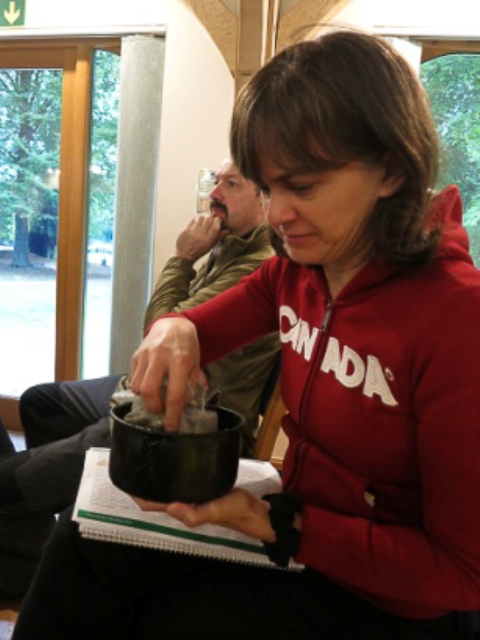 Examining a pot of herbs